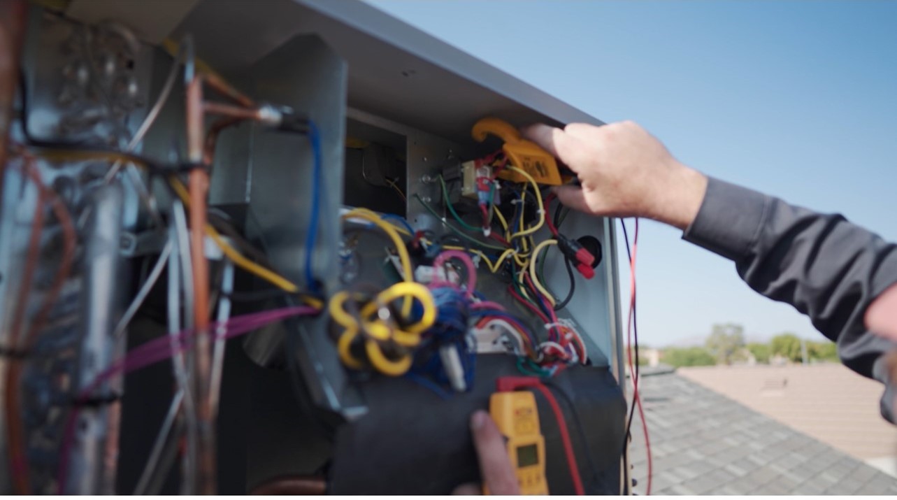 Testing electrical components and controls during a seasonal HVAC tune-up in Fountain Hills